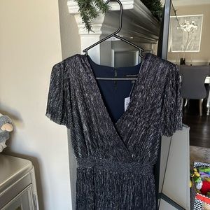 NWT
Bust 34 in /86 cm 
Length 50,5 in/128 cm Really stylish sparkly jumpsuit